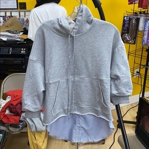 Sweat shirt with a dress shirt attached at bottom